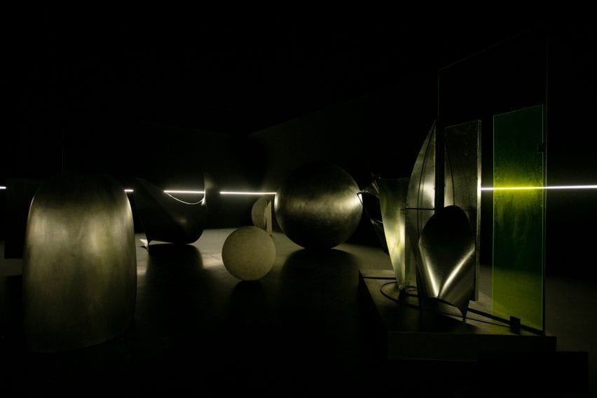 Gleaming metal art in a dark room