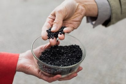 Granules of black biochar plastic