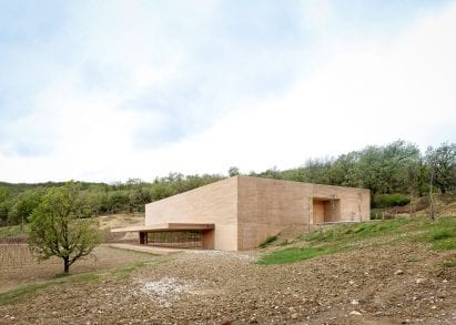 Monolithic ochre-coloured building