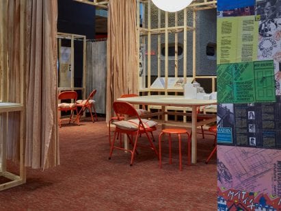 Posters on screens at the How We Live Now exhibition