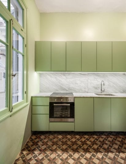 Giannikis used pastel greens in the one-wall kitchen