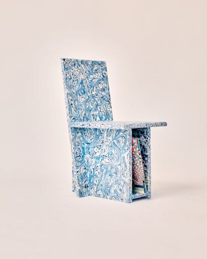 Trash to Chair made from recycled plastic with swirly blue pattern and vinyl storage