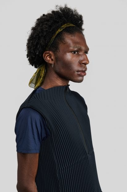 A man wearing a black Petit Pli top