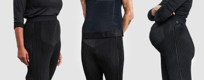 A close up view of three people wearing black Petit Pli clothes