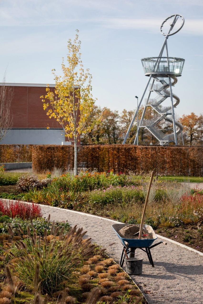 a wheelbarrow pictured on a gravel path