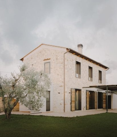 Windows line the ground and first floor of the Casamanda residence