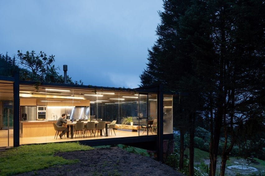 Rama Estudio has enlarged a small house in an Ecuadorian forest by adding a glass-and-metal box that extends over a hillside.