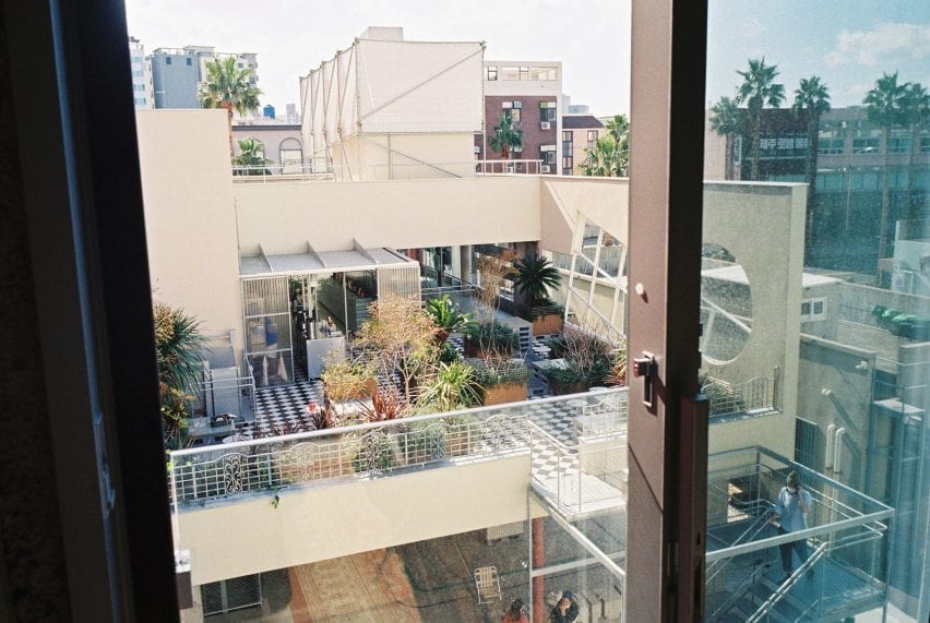 Large windows provide views across the city