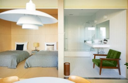 A bathroom in the hotel at the D&Department has a white interior