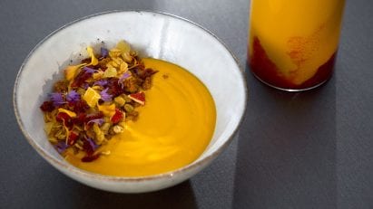Solein protein powder mixed into a smoothie and a bowl of yogurt