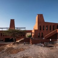 A building finished with terracotta-hued plaster