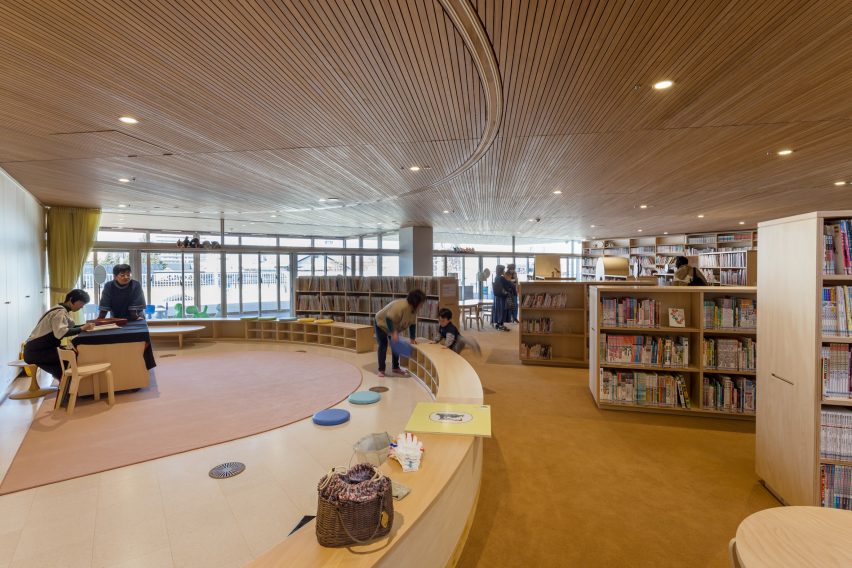 A children's library has a wood and orange interior