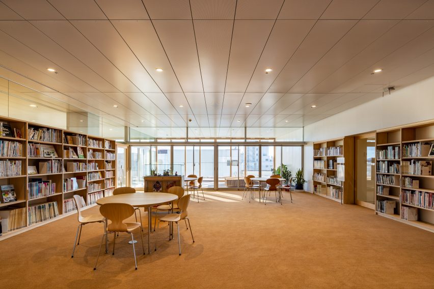 Wooden bookcases line the walls