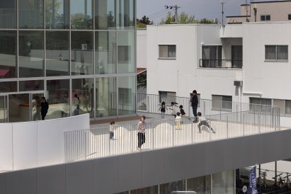 Children are pictured playing on a terrace