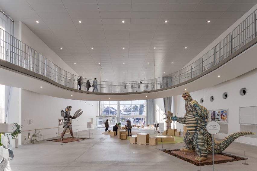 An exhibition space is surrounded by a raised walkway