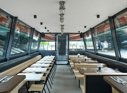 The interior of the cheese barge has wood finishes