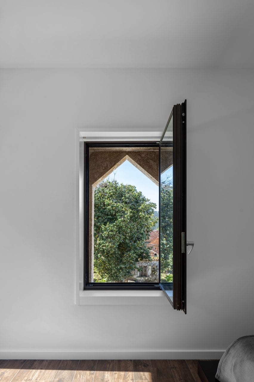 Brick work covers part of the window forming an ornamental detail