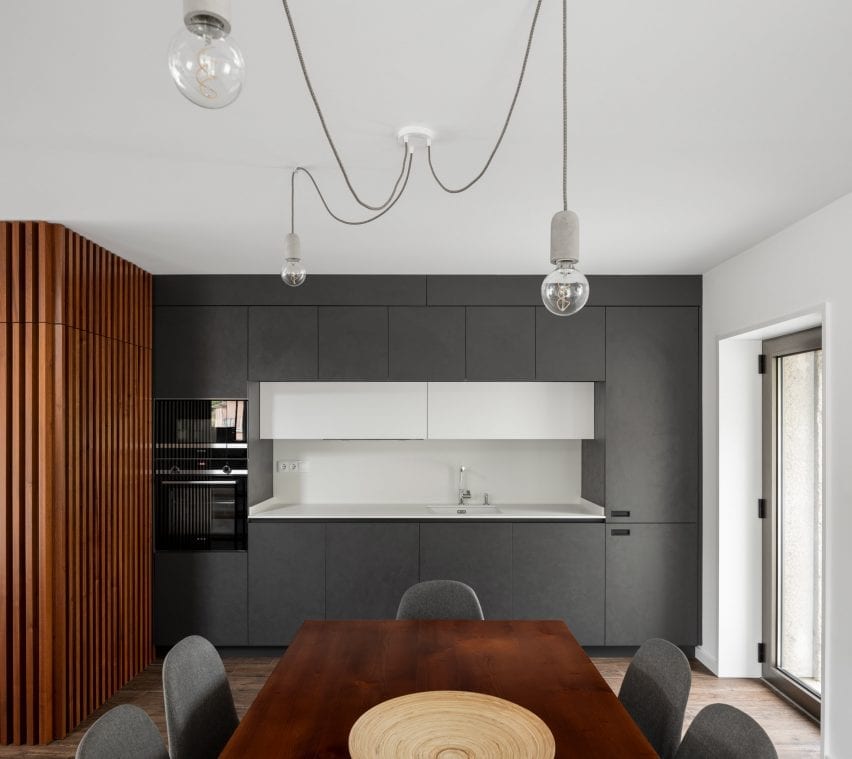The kitchen has a dark finish