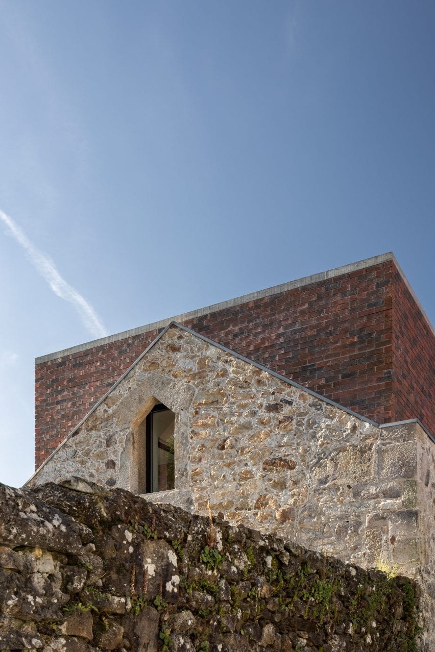 A square volume is at the top of the building