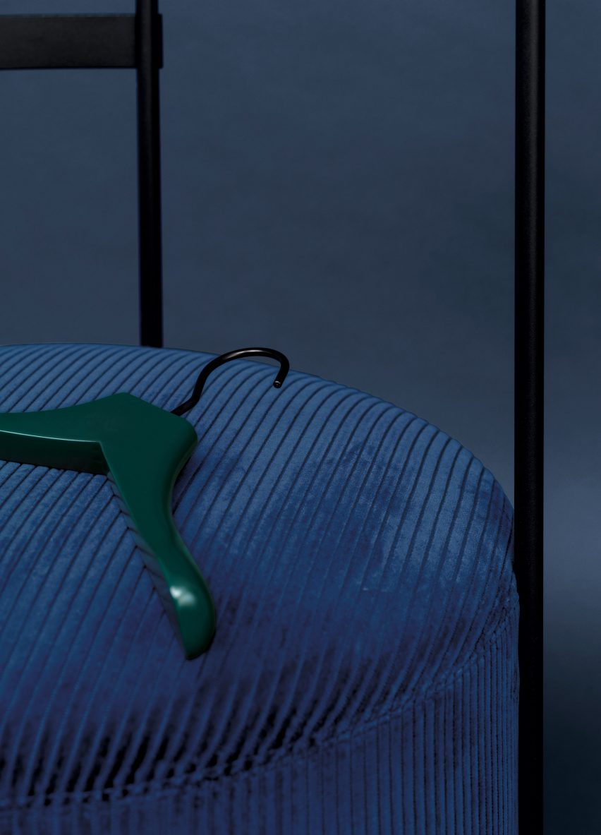 Upholstered pouf attached to coat rack