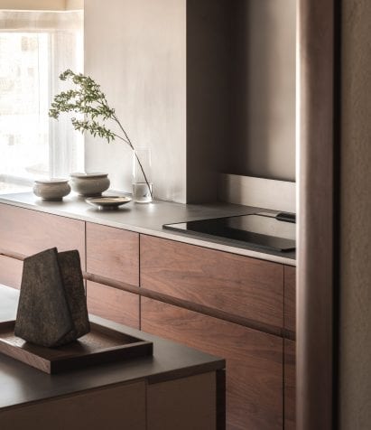 Kitchen with walnut wood shelves in Tokyo flat interior by I IN