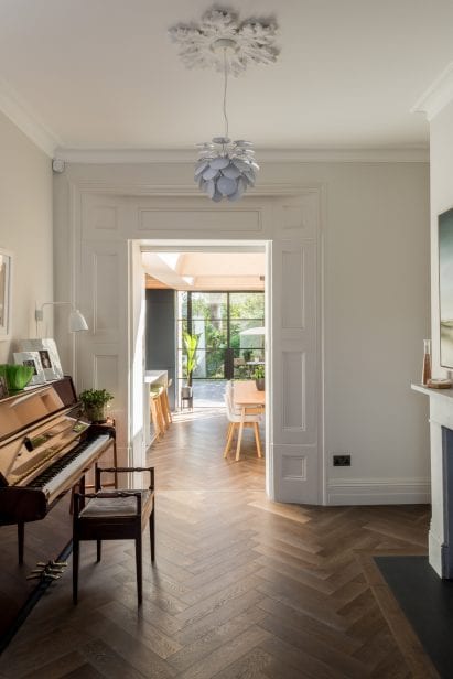 An opening leads from the kitchen to a sitting room in Vault house