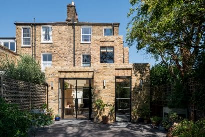 Vault house has black framed windows and doors