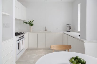 White Brooklyn apartment kitchen renovation with tiles 