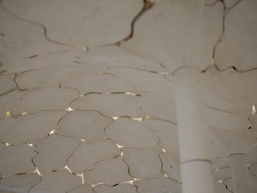Limestone pieces form stone vaulted ceiling