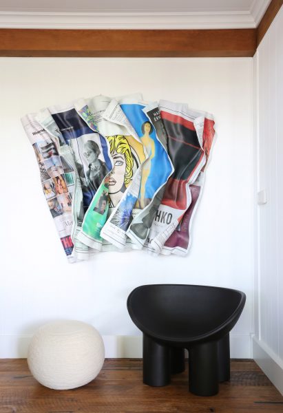 Roly Poly chair by Faye Toogood under art by Paul Rousso