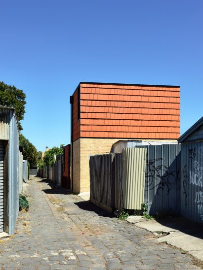 terracotta house is clad in terracotta tiles
