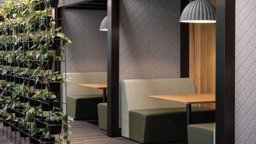 A seating booth with grey Autex acoustic panels