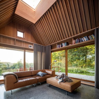 Sofa and in-built shelving in The Author's House by Sleth