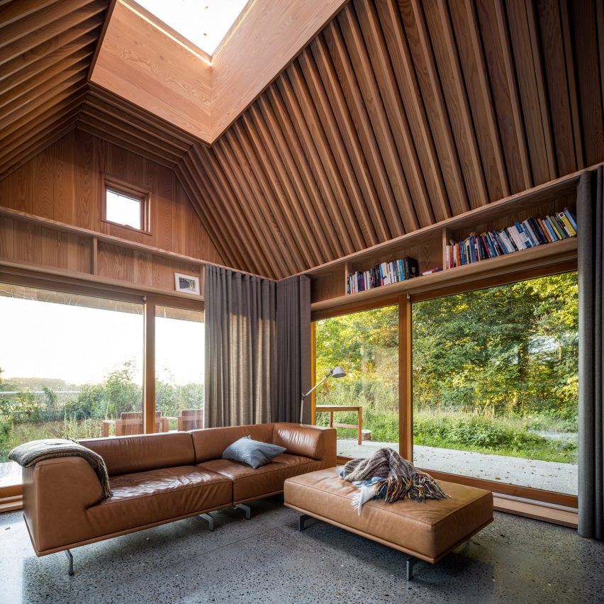 Sofa and in-built shelving in The Author's House by Sleth