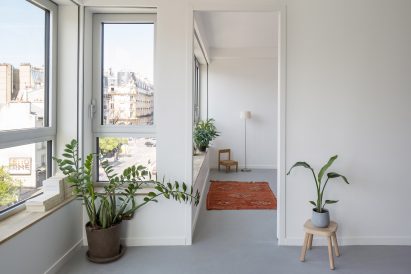 An apartment with grey flooring