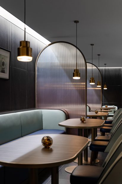 Ombre glass dividers in dining hall interior by SHH