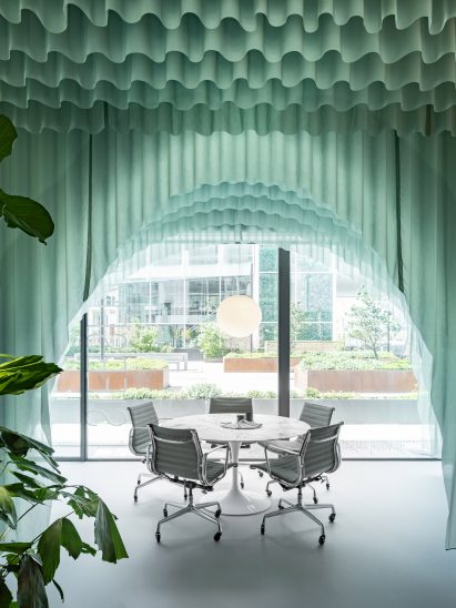 Tables are framed by arched fabrics