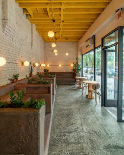 The stooped seating is juxtaposed with smoother elements
