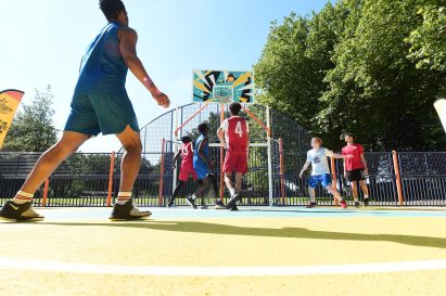 Players play a basketball match in Summerfield Park court