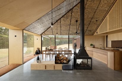a woodburner was placed at the centre of the home