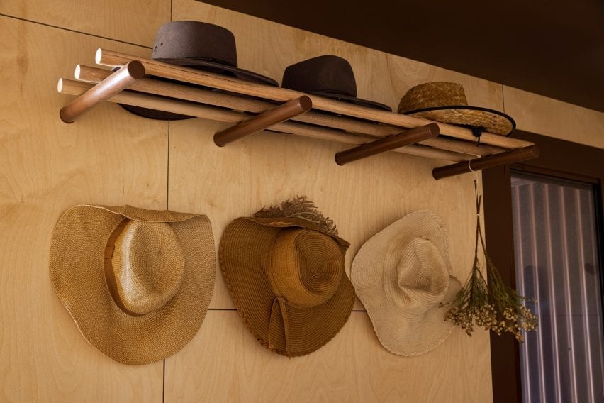 hats are placed on pegs