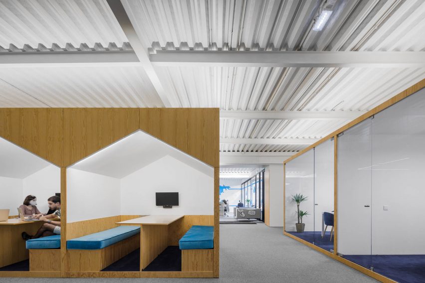 Wooden boxes organise layout of E-goi and Clavel's Kitchen office by Paulo Merlini Architects