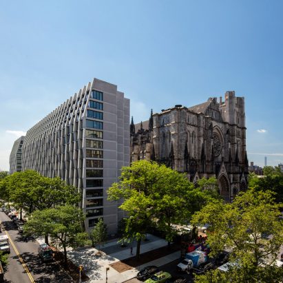 Modern residential tower beside gothic-style cathedral