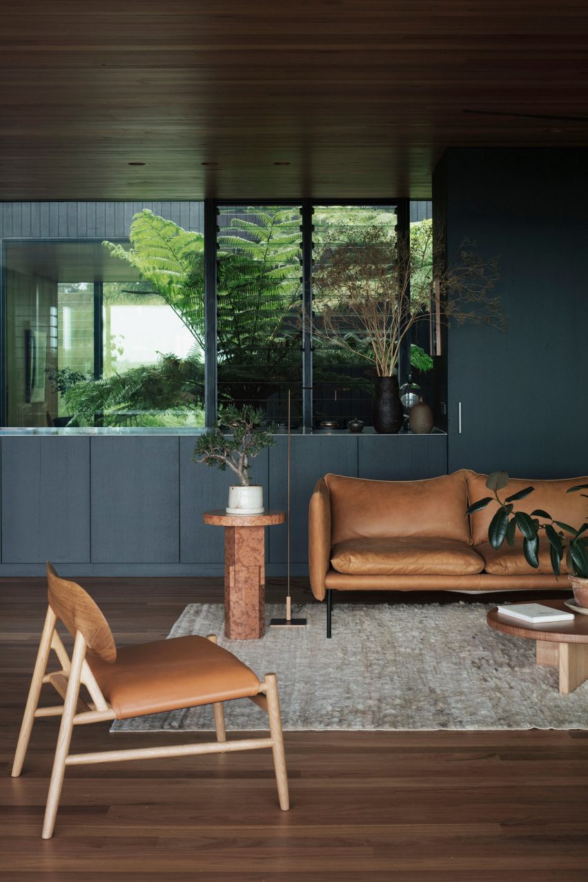 A living room with tan furniture