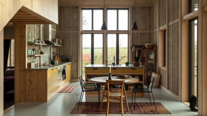 A domestic kitchen with exposed hempcrete walls