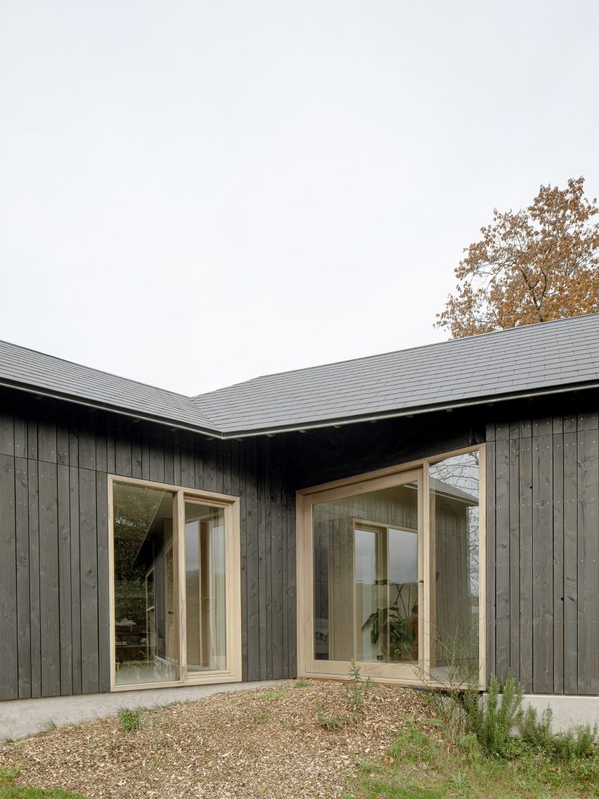Glazed doors mark the entrance to the home