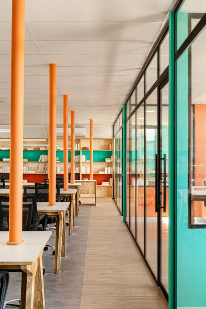 Glazing separates private offices from the main areas