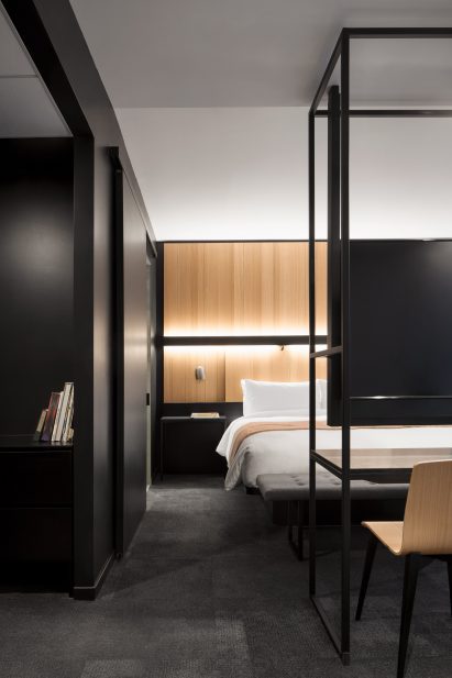 A monochrome bedroom in Hotel Monville in Montreal