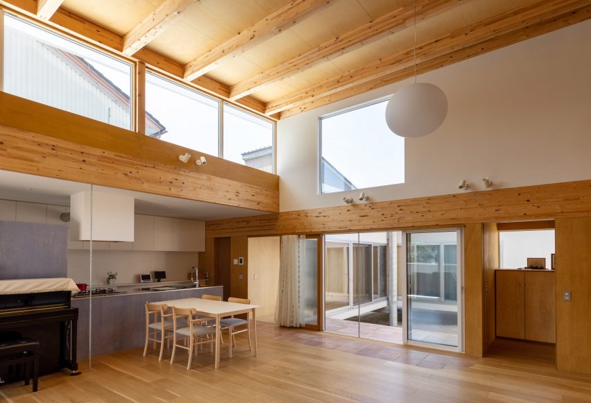Living room with exposed wood ceiling