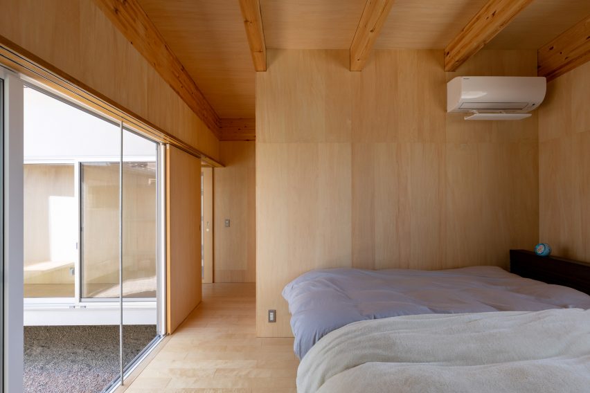 A wood-lined bedroom